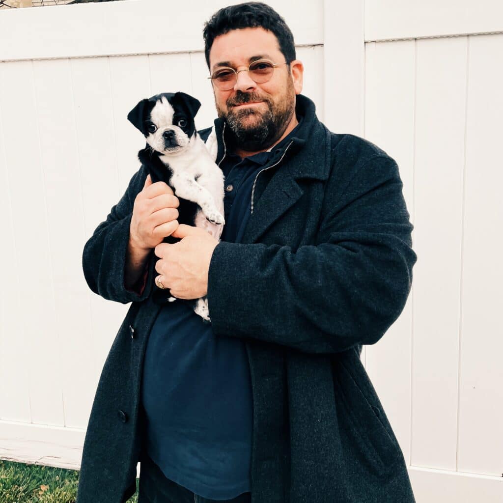 owner with pug puppy