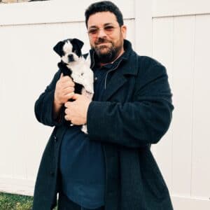 owner with pug puppy