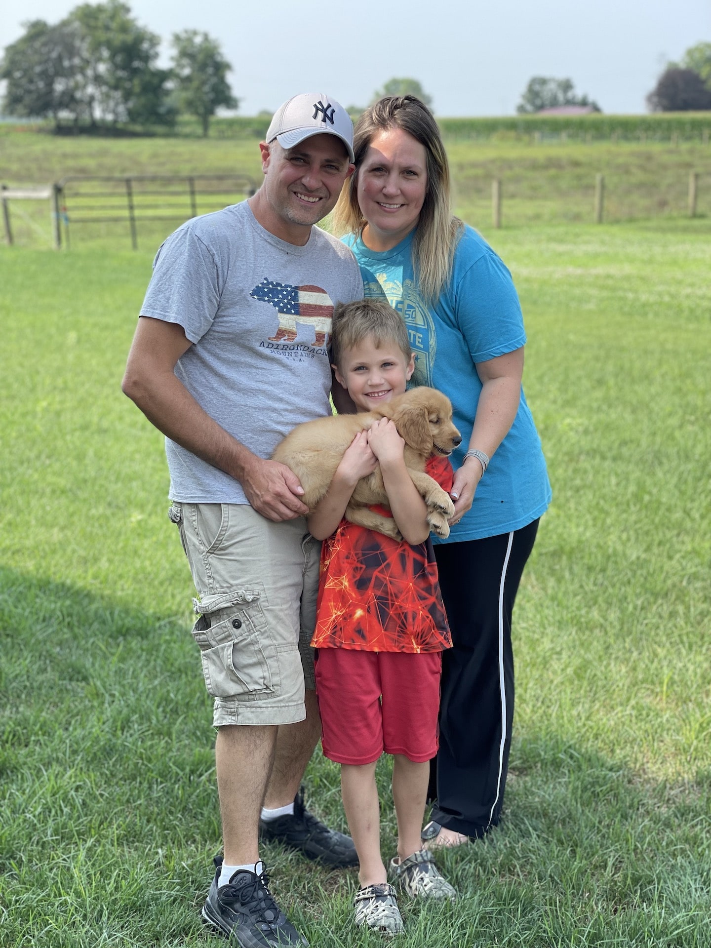 family with golden retriever puppy